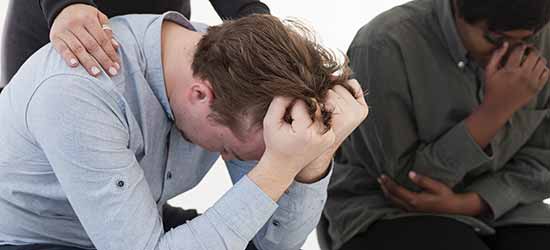stressed man with hands pulling his hair